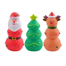 Load image into Gallery viewer, Three Christmas-themed squishy toys on a white background: a Santa Claus figure, a green Christmas tree, and a reindeer snowman.
