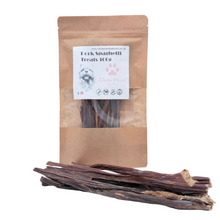 Load image into Gallery viewer, Pouch of Pork Spaghetti Treats 100g with dried treats on a white background
