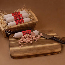 Load image into Gallery viewer, Turkey pate with packaging on a wooden board and background
