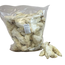 Load image into Gallery viewer, Bag of rabbit feet with a label on a wooden surface
