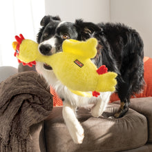 Load image into Gallery viewer, Dog playing with a yellow chicken-shaped toy on a couch
