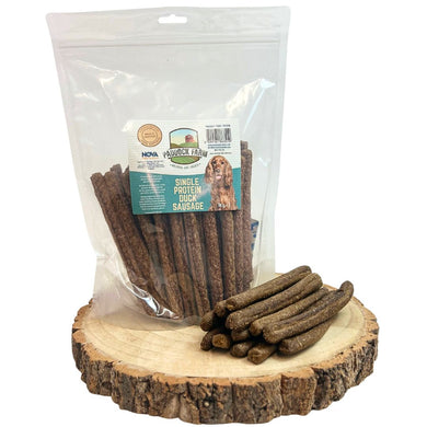 Package of dog treats with a label on a wooden surface
