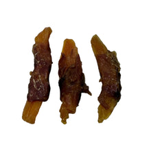 Load image into Gallery viewer, Three brown dog treats on a white surface
