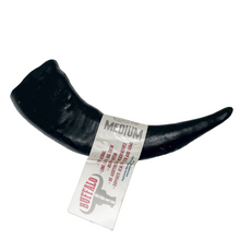 Load image into Gallery viewer, Black horn with a tag on a wooden surface, featuring the &#39;Buffalo by Nova&#39; brand.
