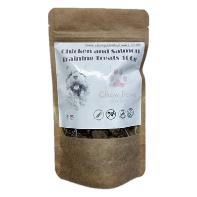 Brown paper bag of chicken and salmon training treats for dogs with a white label.