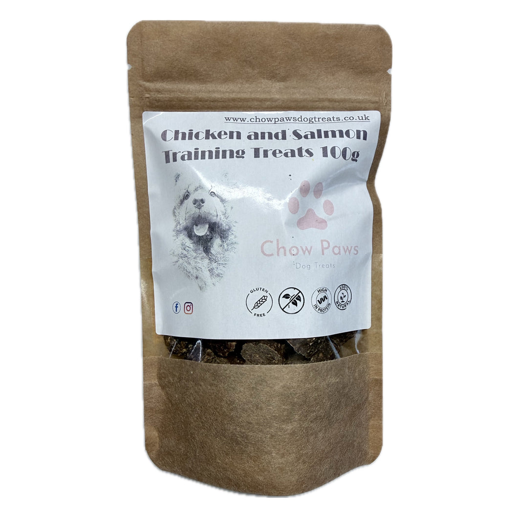Brown paper bag of chicken and salmon training treats for dogs with a white label.