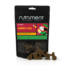 Load image into Gallery viewer, Nutriment Natural Treats Merry Mix gourmet training treats in a black resealable pouch with several brown star-shaped treats displayed in front on a white background.
