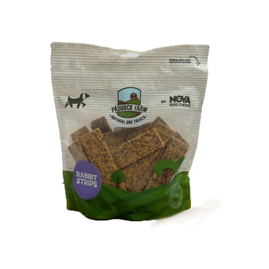 A package of Nova Paddock Farm 100% Rabbit Strips 500g. The product is presented in a clear plastic packaging with a green label, showcasing the rabbit strips inside.