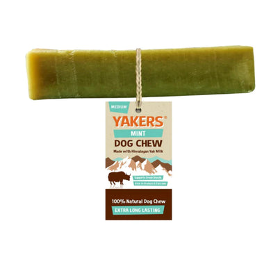 A medium-sized green Yakers mint dog chew treat, made with Himalayan Yak Milk, attached to a cardboard hanger with product information.
