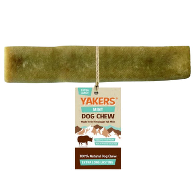 A green colored, cylindrical Yakers mint dog chew treat, with packaging attached displaying product information.